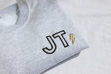 Load image into Gallery viewer, Ash grey crewneck with initials shown in Outline font with a metallic lightning bolt on the side of the initials.