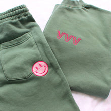 Load image into Gallery viewer, Hunter Green K set, with Outline font embroidery on crewneck and a two toned pink smiley face embroidered on shorts
